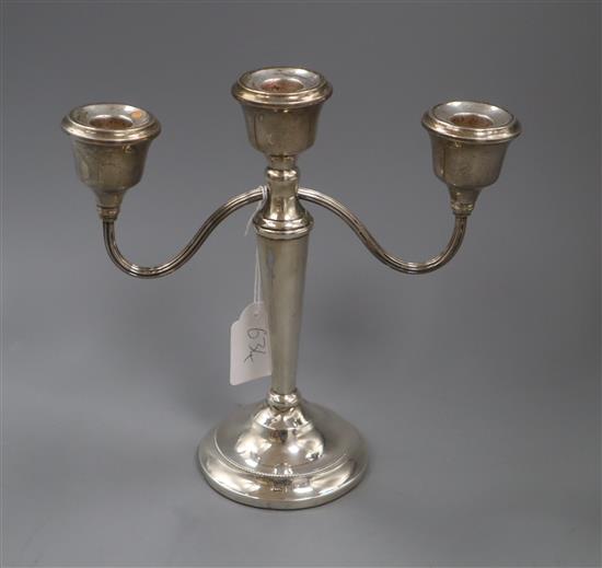 A modern silver two branch, three light candelabrum,